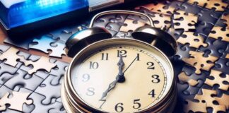 Alarm, puzzle pieces and a police light