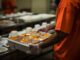 Prisoner with tray of prison food