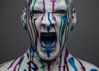 screaming man covered in paint